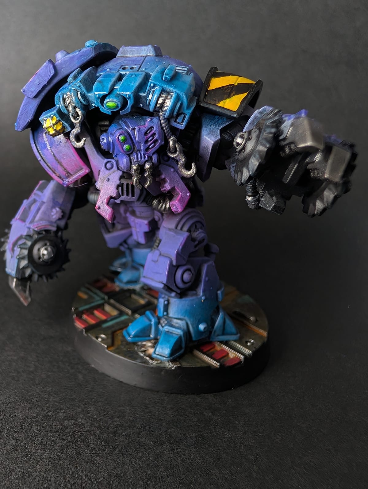 Ambot miniature painted in a neon vapourwave scheme with purple and cyan blends